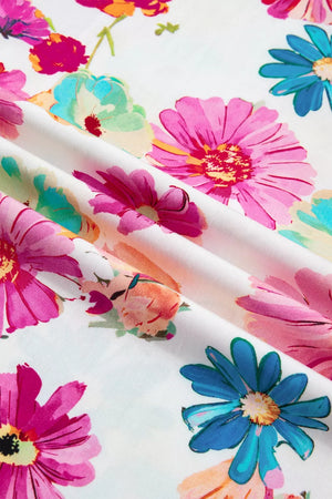 Vibrant floral print cotton blouse with a V-neck and short sleeves.
