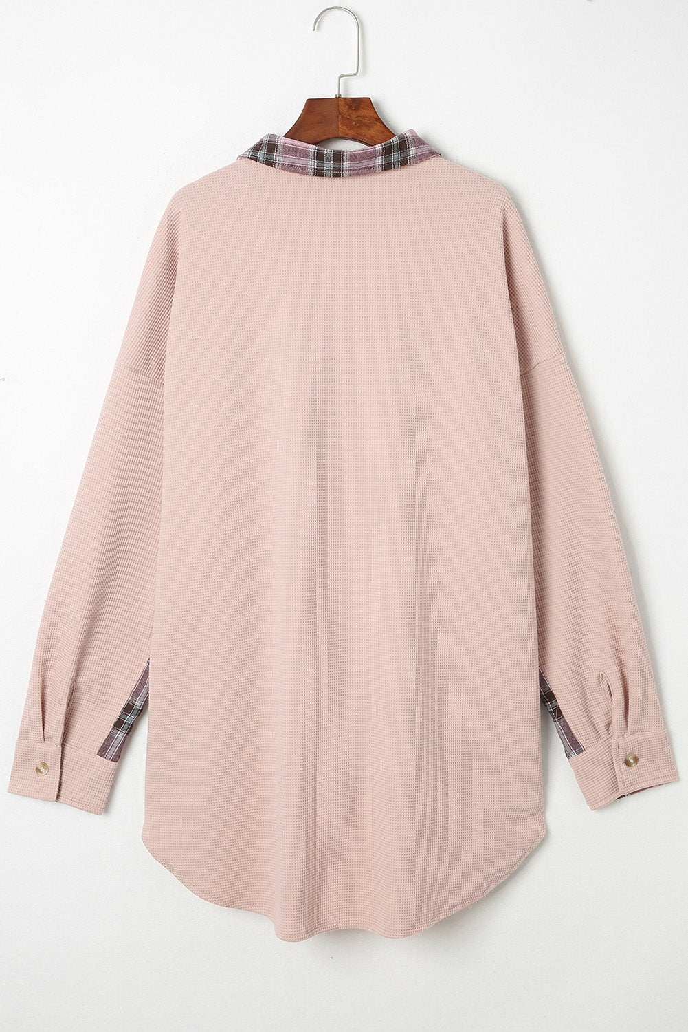 Blush pink waffle knit overshirt with plaid collar and sleeve trim.