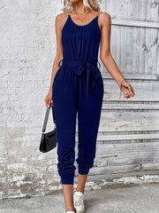 Dark blue chain-strap gathered waist jumpsuit with tie belt and cuffed ankles