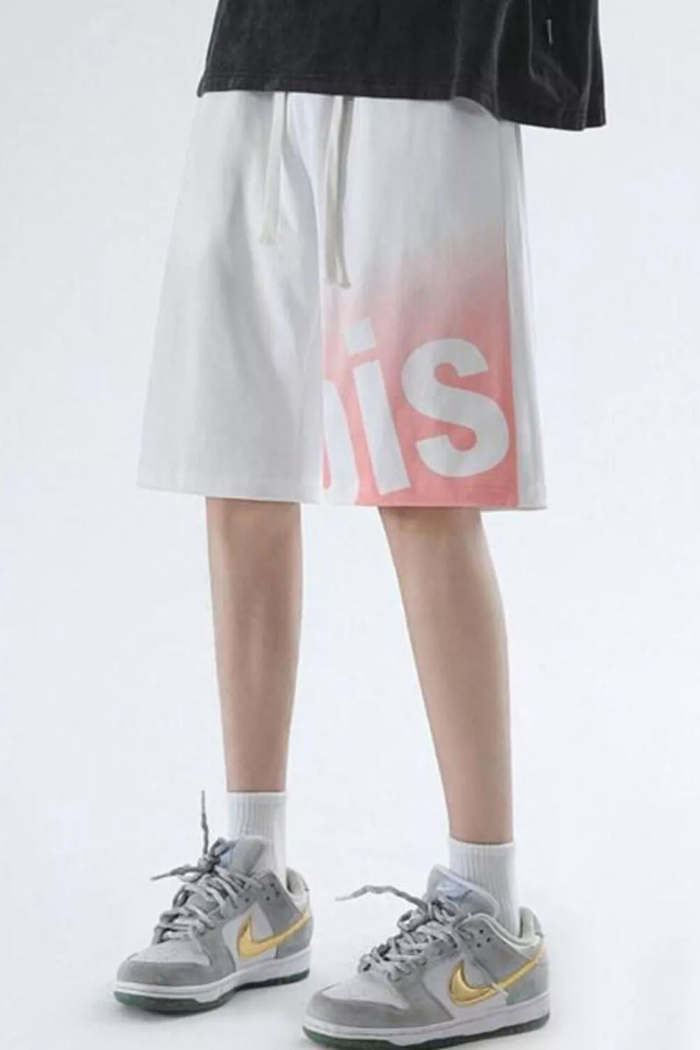 Men's white casual shorts with pink gradient lettering and drawstring waist.
