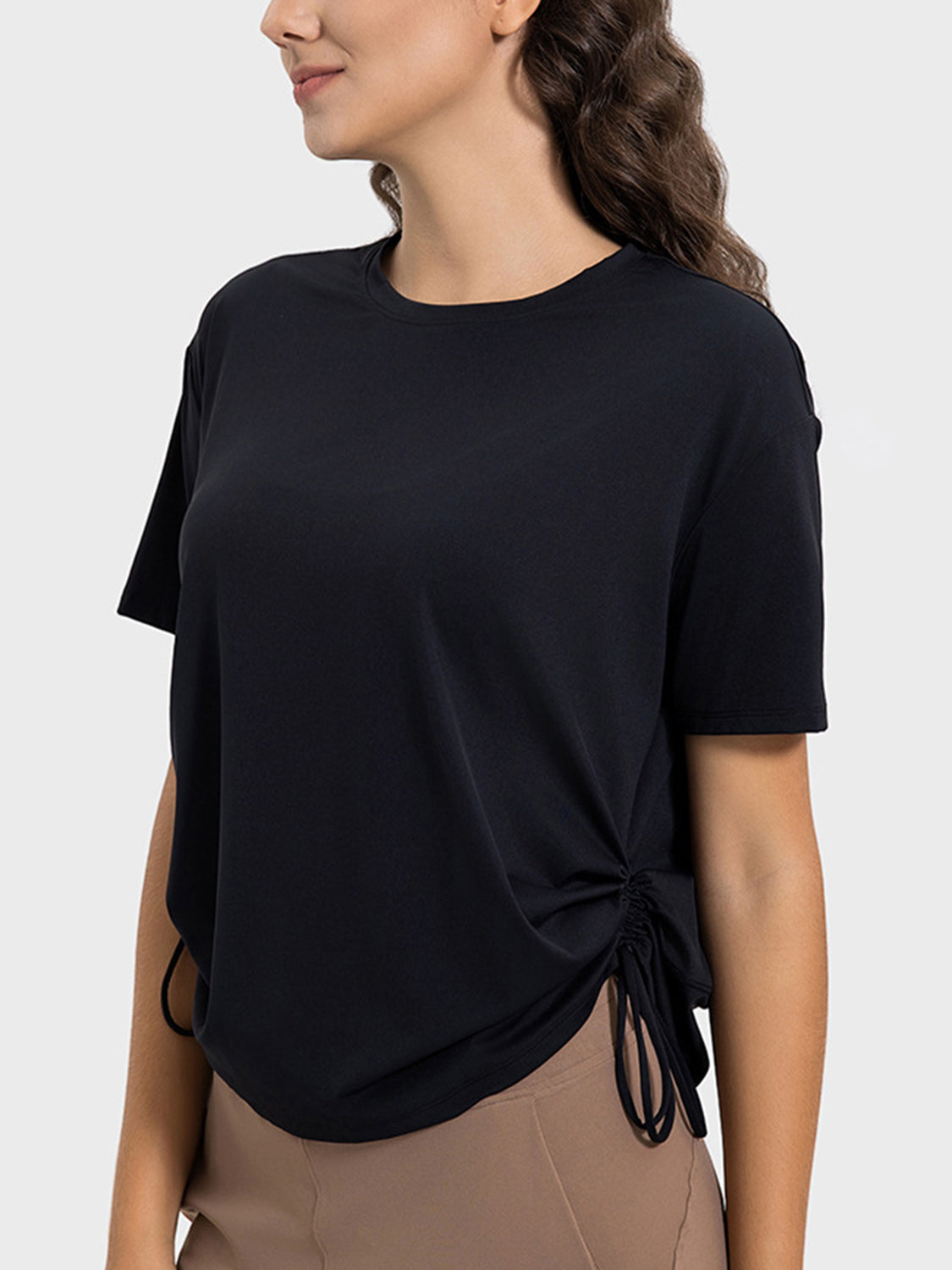 Black jersey t-shirt with side tie detail and short sleeves.