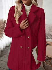 Red faux shearling double-breasted coat with cable knit texture and button closure.