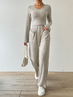 Flared ribbed knit lounge set in dust storm with v-neck top and wide leg pants with pockets.