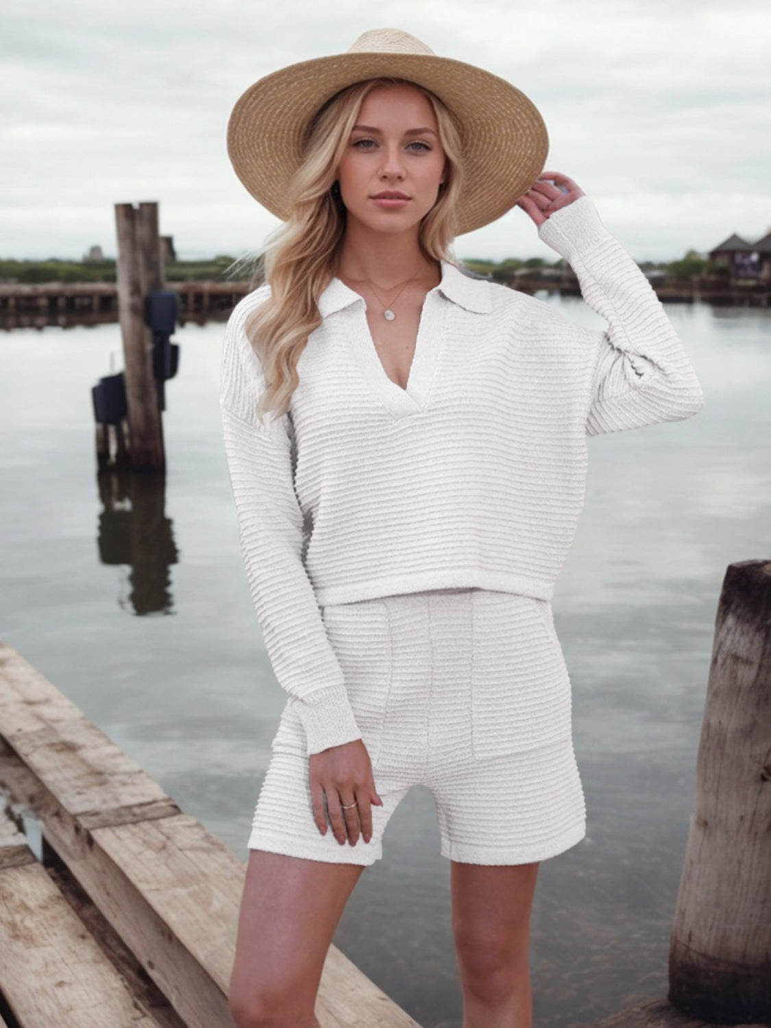 White textured knit polo sweater and shorts set with a V-neck and long sleeves.
