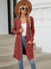 Textured ribbed knit duster cardigan in burgundy with pockets and open front.