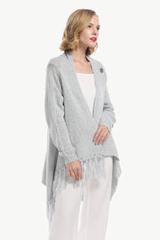 Gray asymmetric fringe knit cardigan with button detail and open front.