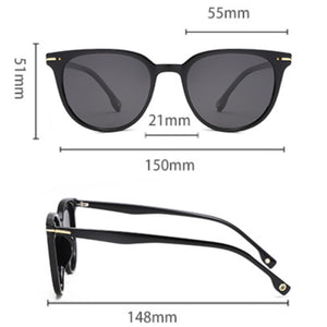 Black cat-eye sunglasses with polycarbonate frame and UV400 protection.
