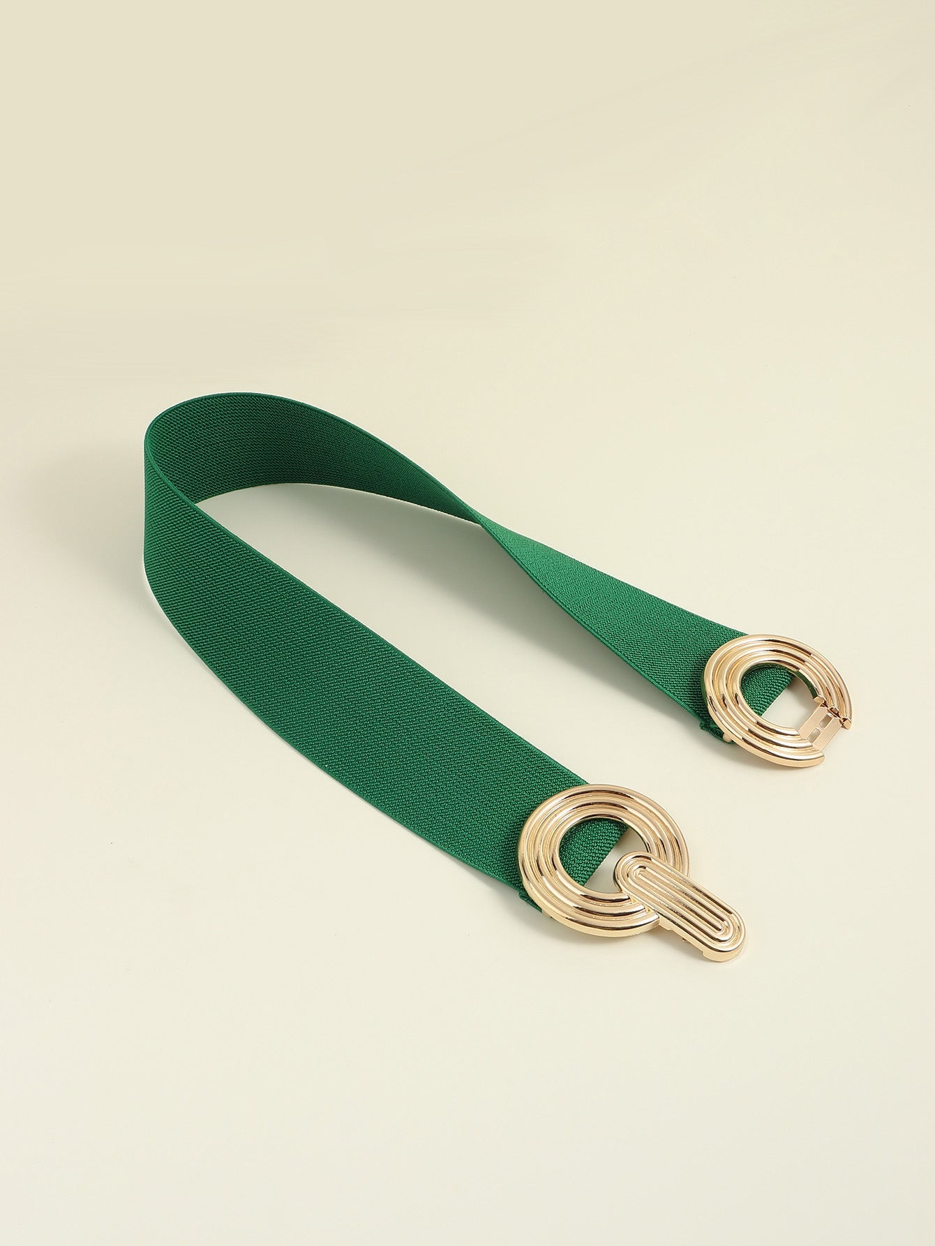 Green elastic belt with interlocking gold circles detail