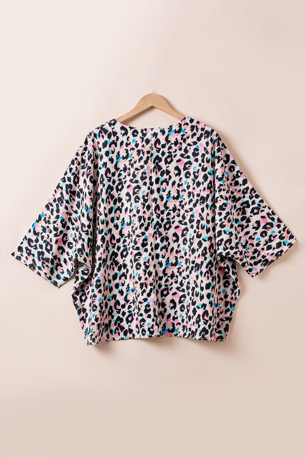 Color Pop Leopard Print Batwing Top with colorful leopard pattern and wide sleeves.