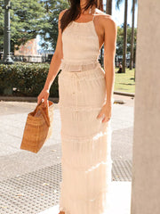 Cream halter neck smocked two-piece maternity swim dress with tiered ruffles.