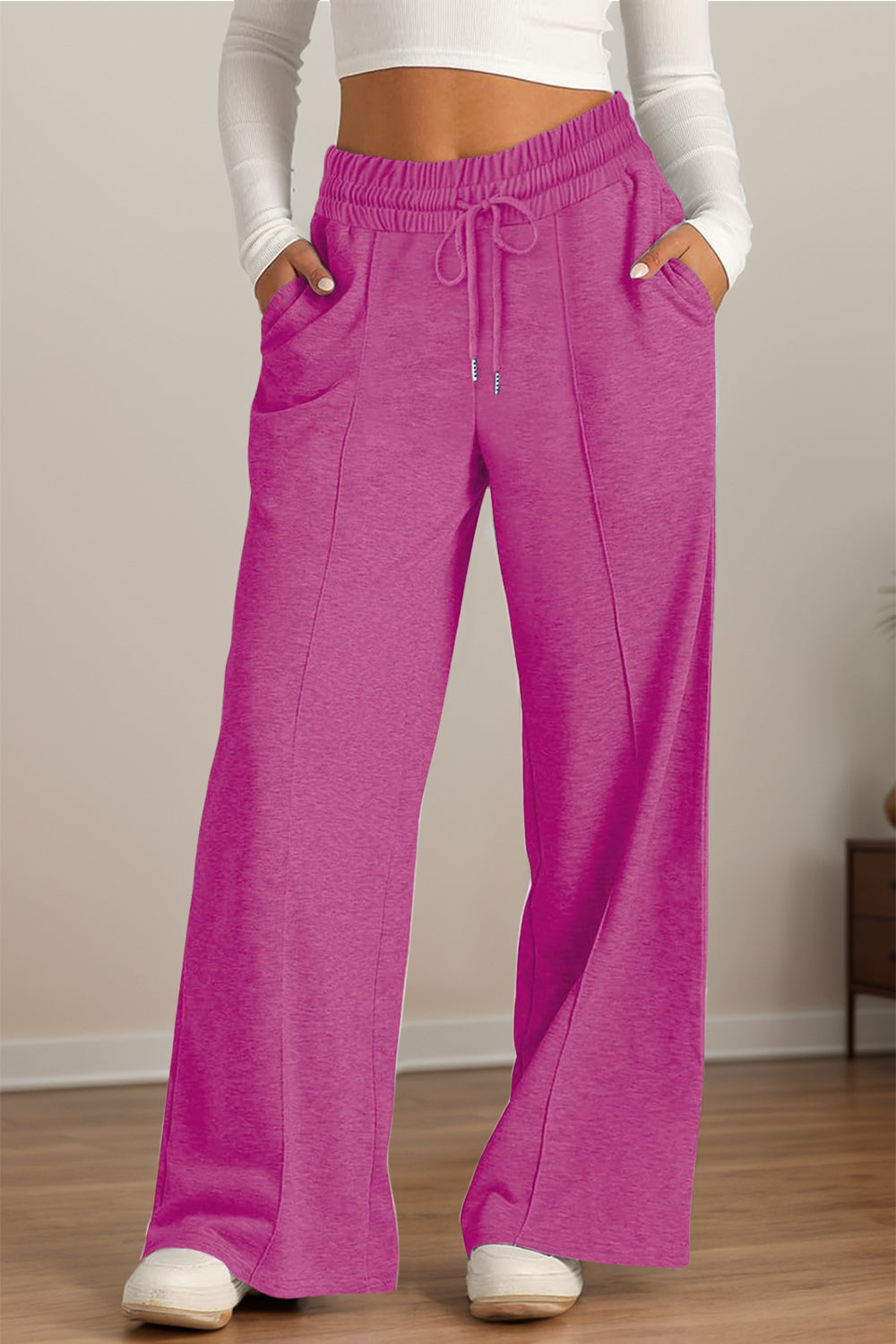 Seamed palazzo lounge trousers in fuchsia pink with drawstring waist and pockets.