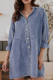 Light blue denim shirtdress with button front and ruffled cuff detail