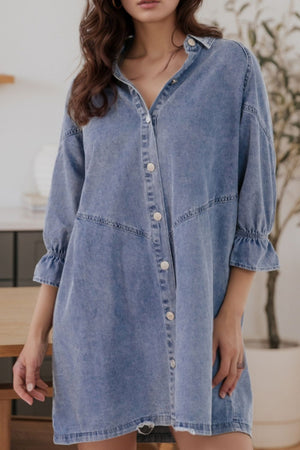 Light blue denim shirtdress with button front and ruffled cuff detail