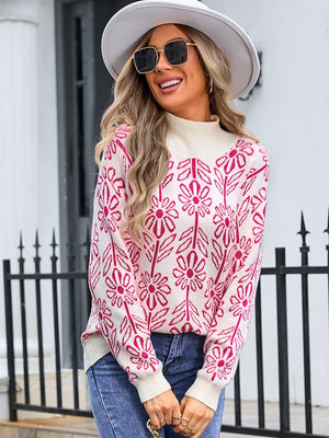 Geometric floral knit turtleneck pullover in cream with pink floral pattern.