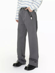 Men's relaxed fit grey cotton jeans with button closure and black belt.