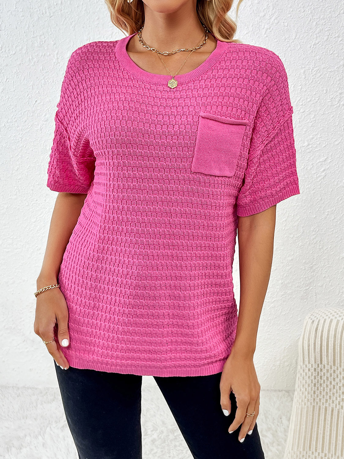 Hot pink textured knit t-shirt with boxy silhouette and chest pocket.