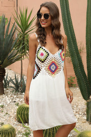 White maxi dress with colorful crochet yoke and V-neckline