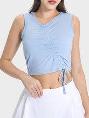 Light blue asymmetric ruched crop tank top with drawstring detail