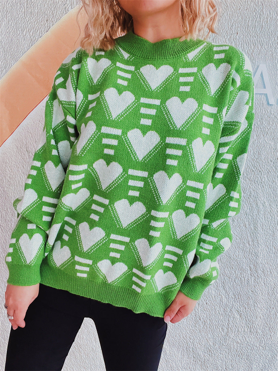 Neon green acrylic knit jumper with white geometric heart pattern, crew neck, long sleeves.