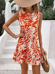 Tropical leaf print mini dress with ruffled hem and sleeveless design.