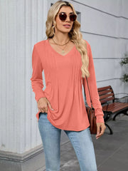Coral V-neck long sleeve maternity t-shirt with front pleats and a relaxed fit.