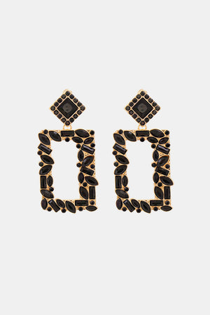 Black geometric jewel box earrings with gold alloy frames and faceted black stones.