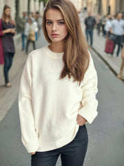 Oversized white crewneck knit pullover sweater with ribbed cuffs and hem.