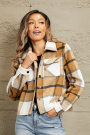 Camel plaid shacket with contrast collar, buttoned front, and chest pockets.