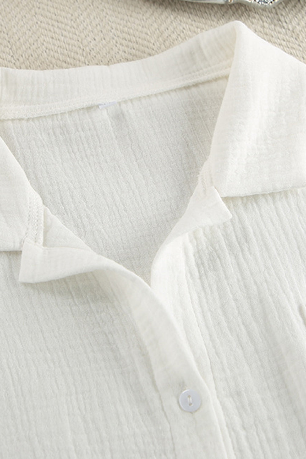 White gauze pajama top with collared neckline and button detail