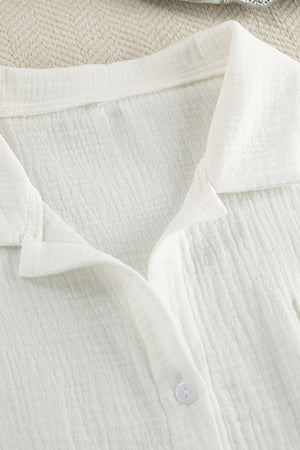 White gauze pajama top with collared neckline and button detail