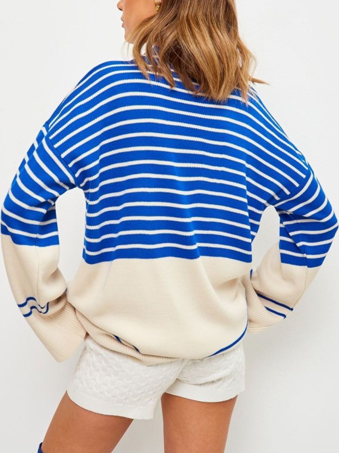 Colorblock stripe knit sweater with bell sleeves and cream bottom