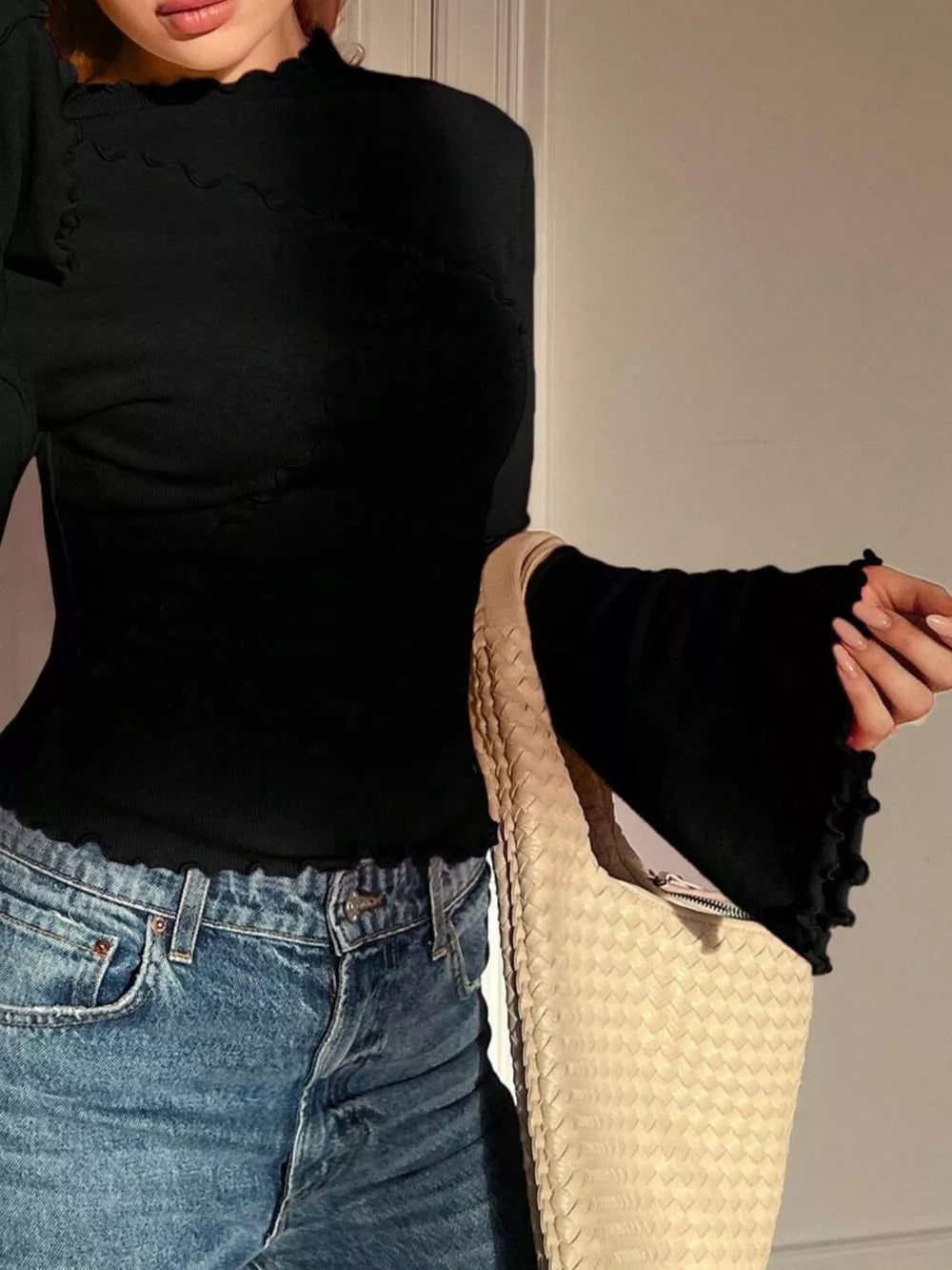 Black lettuce edge flare sleeve t-shirt with lettuce edge hem and neckline
