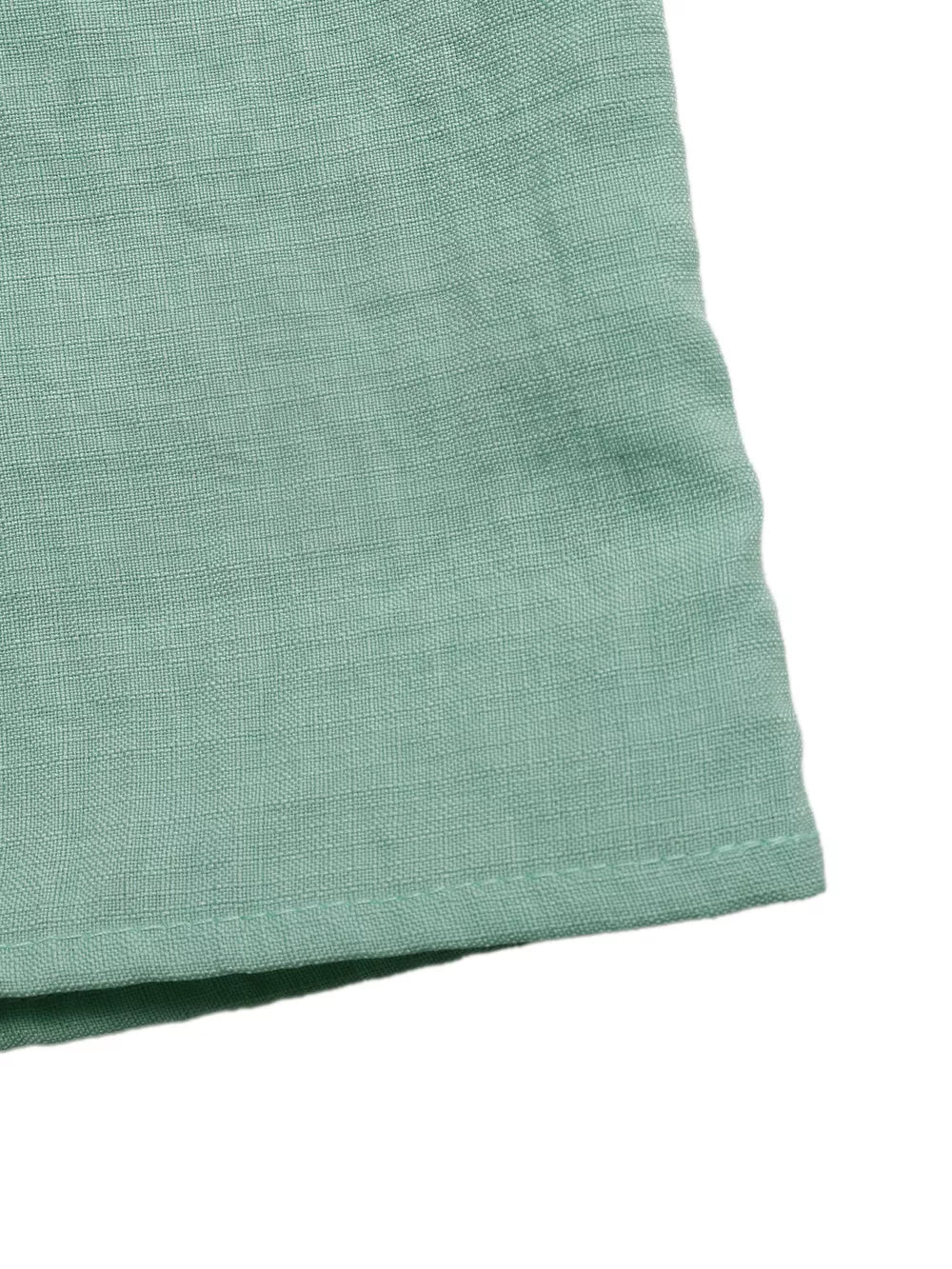 Maternity maxi dress in sage green linen-blend fabric with a subtle texture and neat hem stitching.