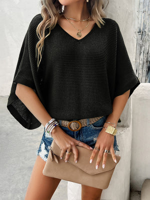 Black open-knit dolman sleeve v-neck sweater with a textured stripe pattern.