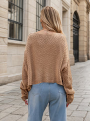 Camel acrylic cable knit cocoon sweater with a relaxed fit and wide sleeves.