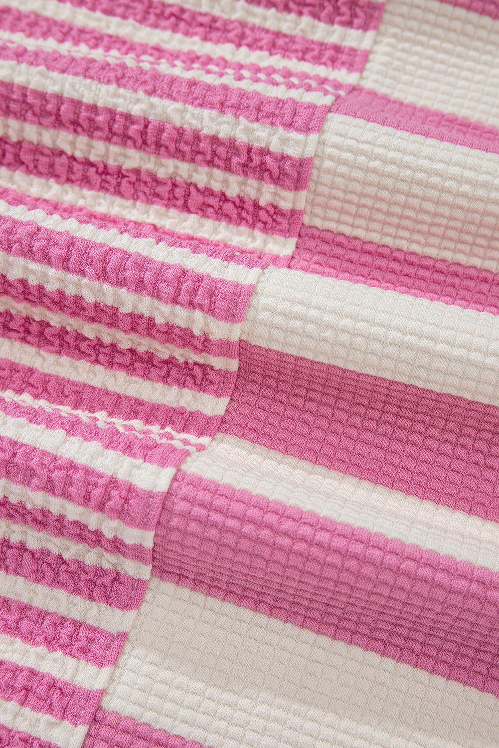 Pink and white striped waffle knit top with colorblock detail