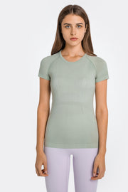 Sage green seamless activewear tee with subtle textured details and a crew neck.