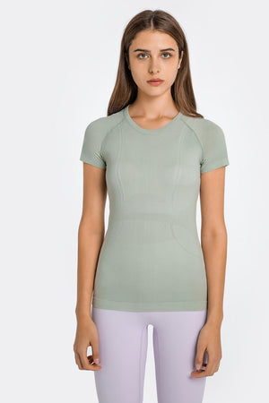 Sage green seamless activewear tee with subtle textured details and a crew neck.