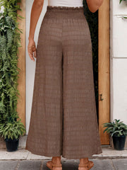 Brown textured smocked waist wide-leg trousers with a comfortable fit.