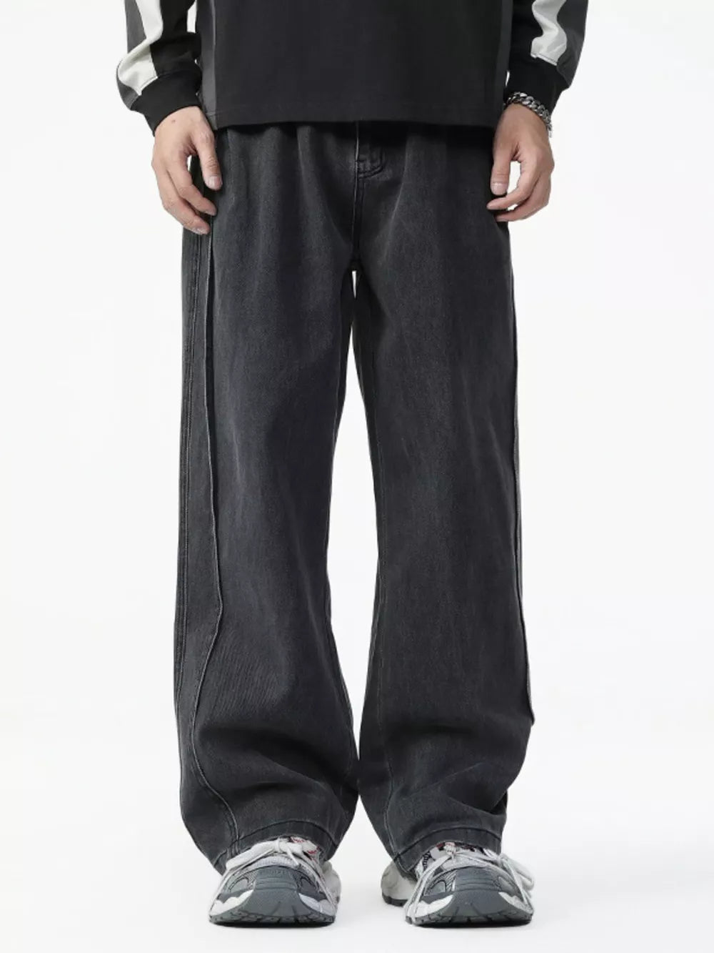 Men's dark wash cotton wide-leg jeans with elastic waist and contrast stitching.