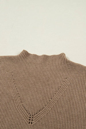 Brown ribbed knit mock neck sweater vest with V-shaped detail and lettuce edge neckline.