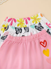 Baby shorts set with butterfly and floral prints, pink with heart appliques.
