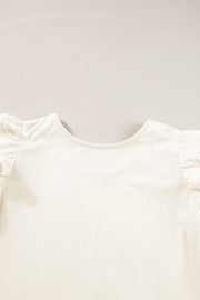 Eggshell textured blouse with ruffle sleeves and a scoop neck.
