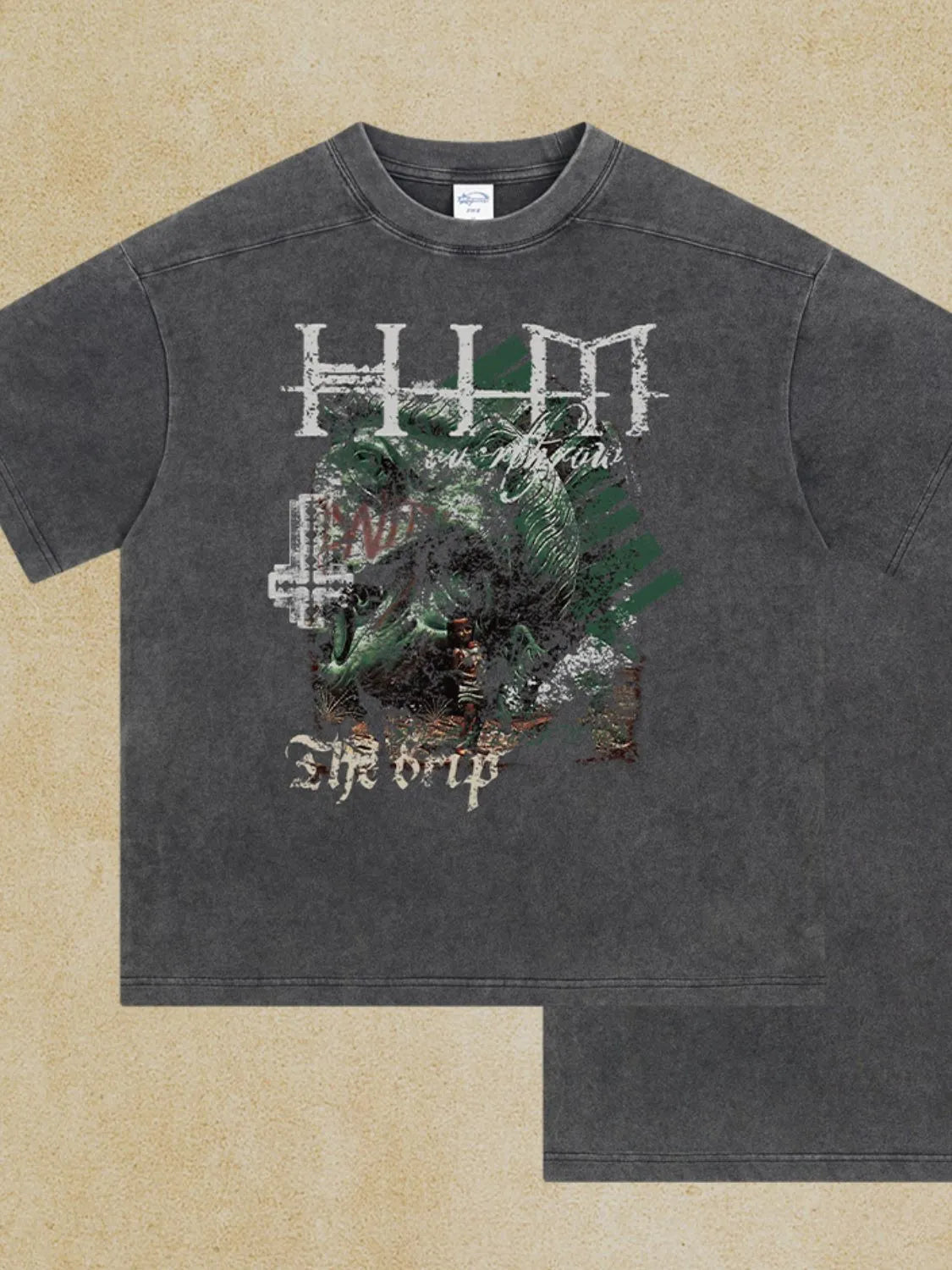 Dark gray acid wash graphic tee with "The Drip" text and distressed artwork.