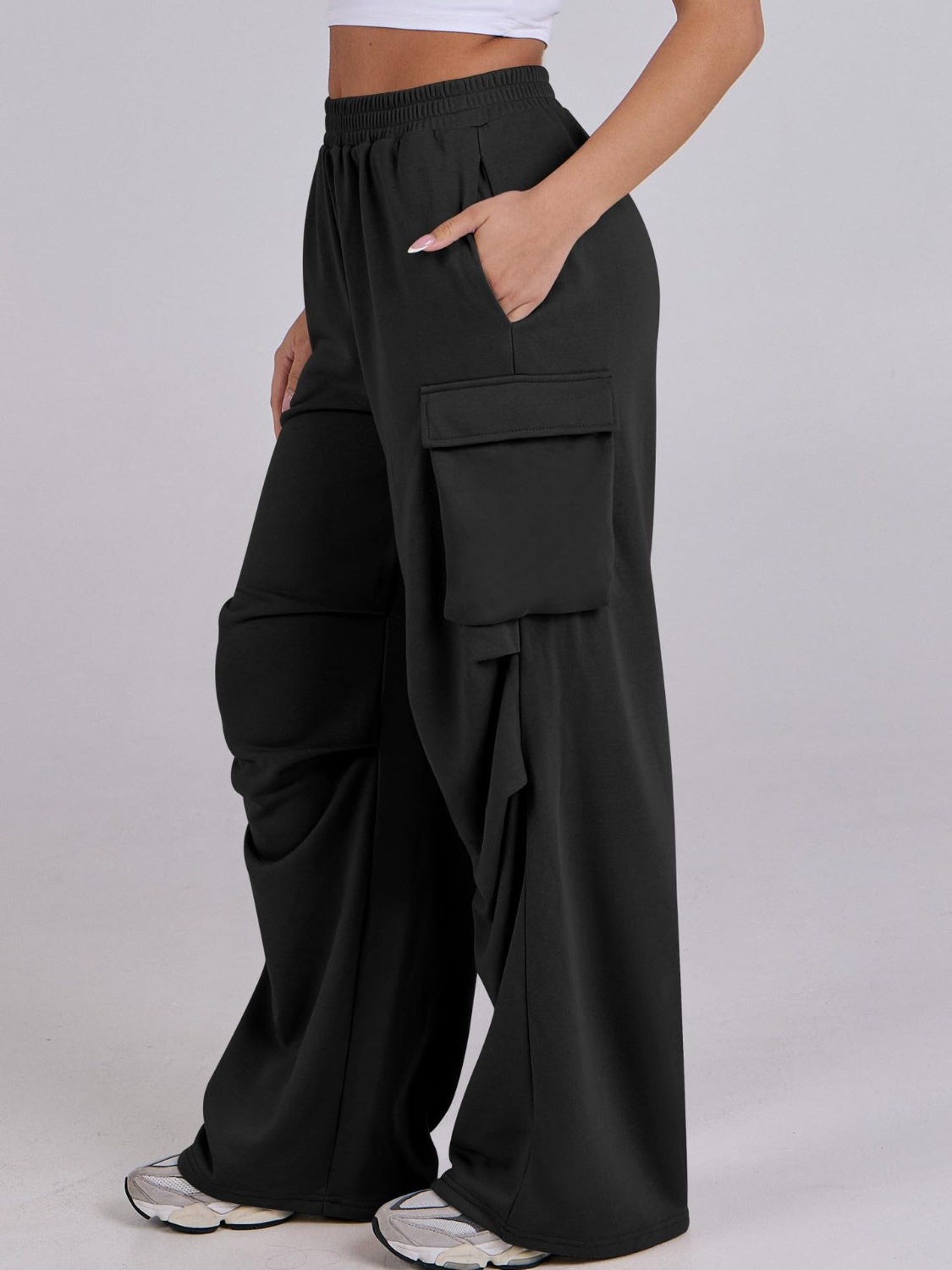 Black cargo pocket drape wide leg sweatpants with a relaxed fit.