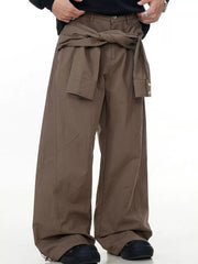 Brown wide-legged cargo pants with a tie waist and buttoned cuffs.