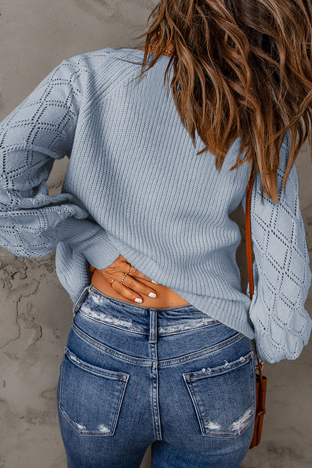 Light blue diamond-cut sleeve knit cardigan with textured body and ribbed cuffs.