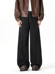 Black 100% cotton wide-leg jeans with contrast stitching and baggy fit.