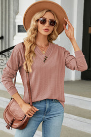 Dusty Pink textured cable-knit henley pullover with V-neck and button detail.