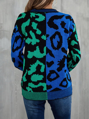 Split leopard knit sweater in blue/green with statement sleeves and crew neck.